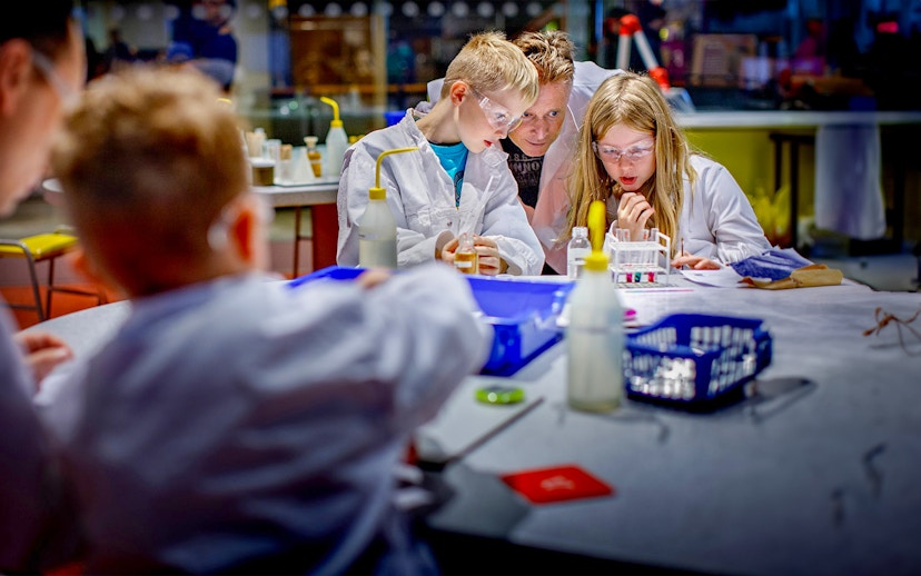 Children conducting experiments at NEMO Science Museum, Amsterdam.