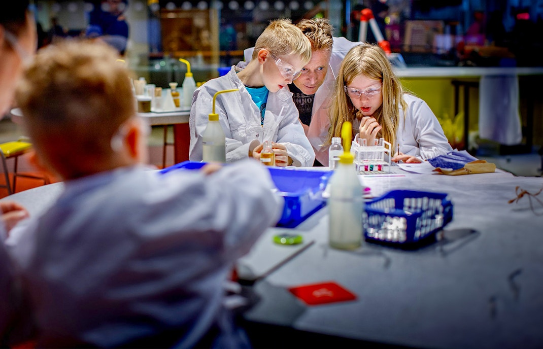 Children conducting experiments at NEMO Science Museum, Amsterdam.