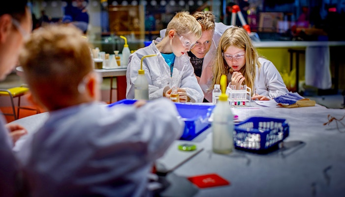 Children conducting experiments at NEMO Science Museum, Amsterdam.