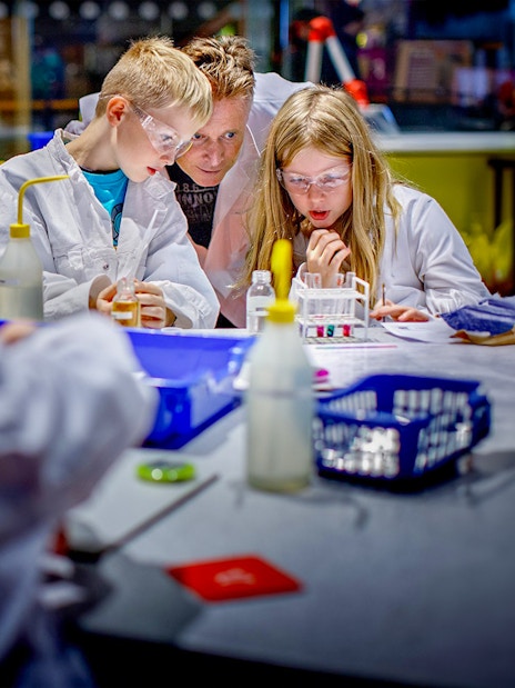 Children conducting experiments at NEMO Science Museum, Amsterdam.