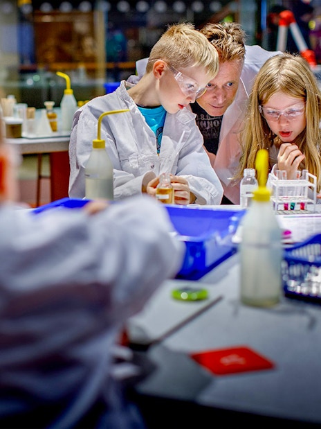 Children conducting experiments at NEMO Science Museum, Amsterdam.
