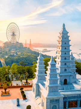 Sun World Ha Long complex with Ferris wheel and pagoda at sunset, Ha Long Bay, Vietnam.