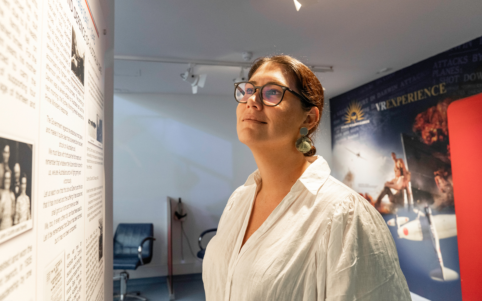 Visitor exploring exhibit at Darwin Royal Flying Doctor Service museum.