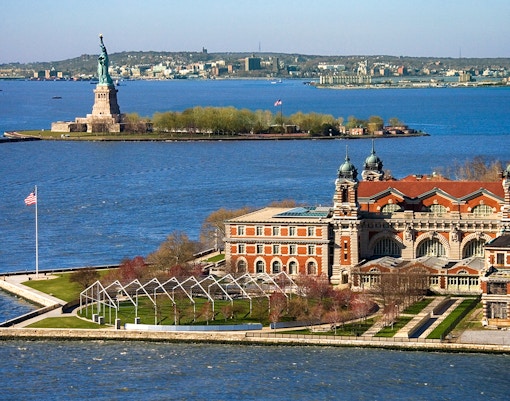 Aerial view of Ellis Island with the Statue of Liberty in New York Harbor.