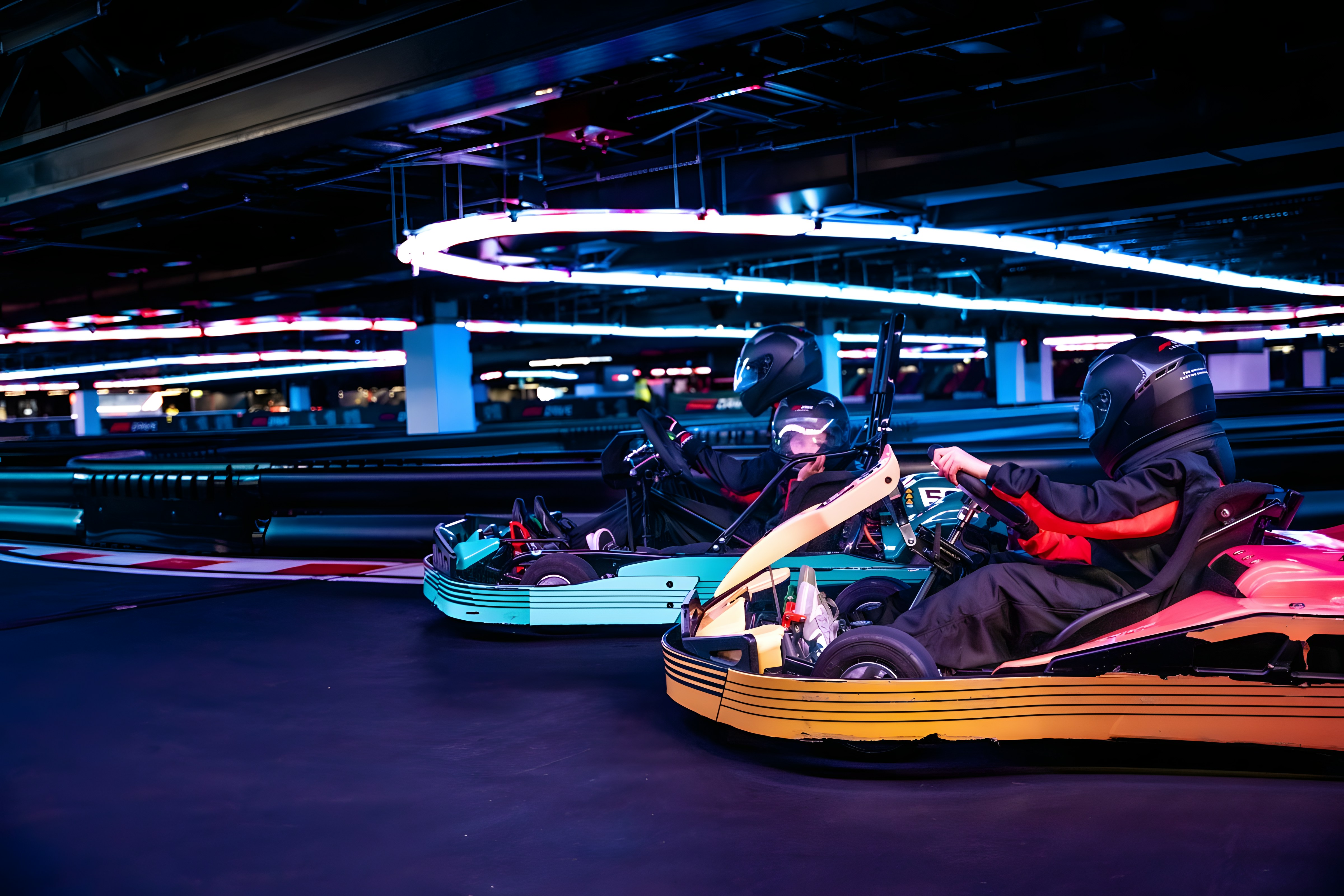 Guests racing go-karts on the mixed grid session at the F1 Experience in London.