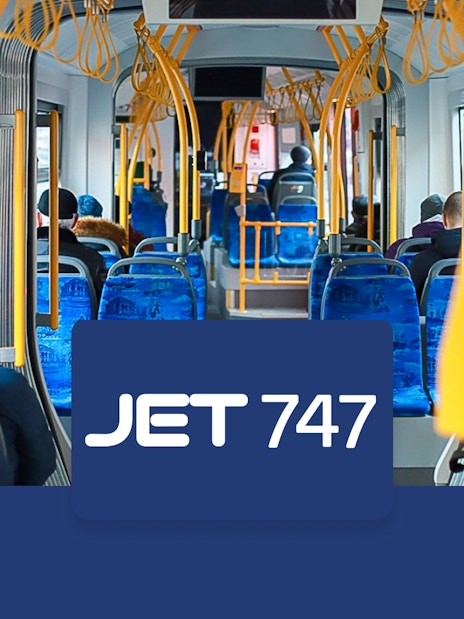 Passengers seated inside a JET 747 bus from Edinburgh Airport to Halbeath Park & Ride.