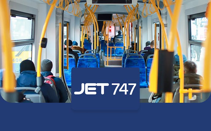 Passengers seated inside a JET 747 bus from Edinburgh Airport to Halbeath Park & Ride.