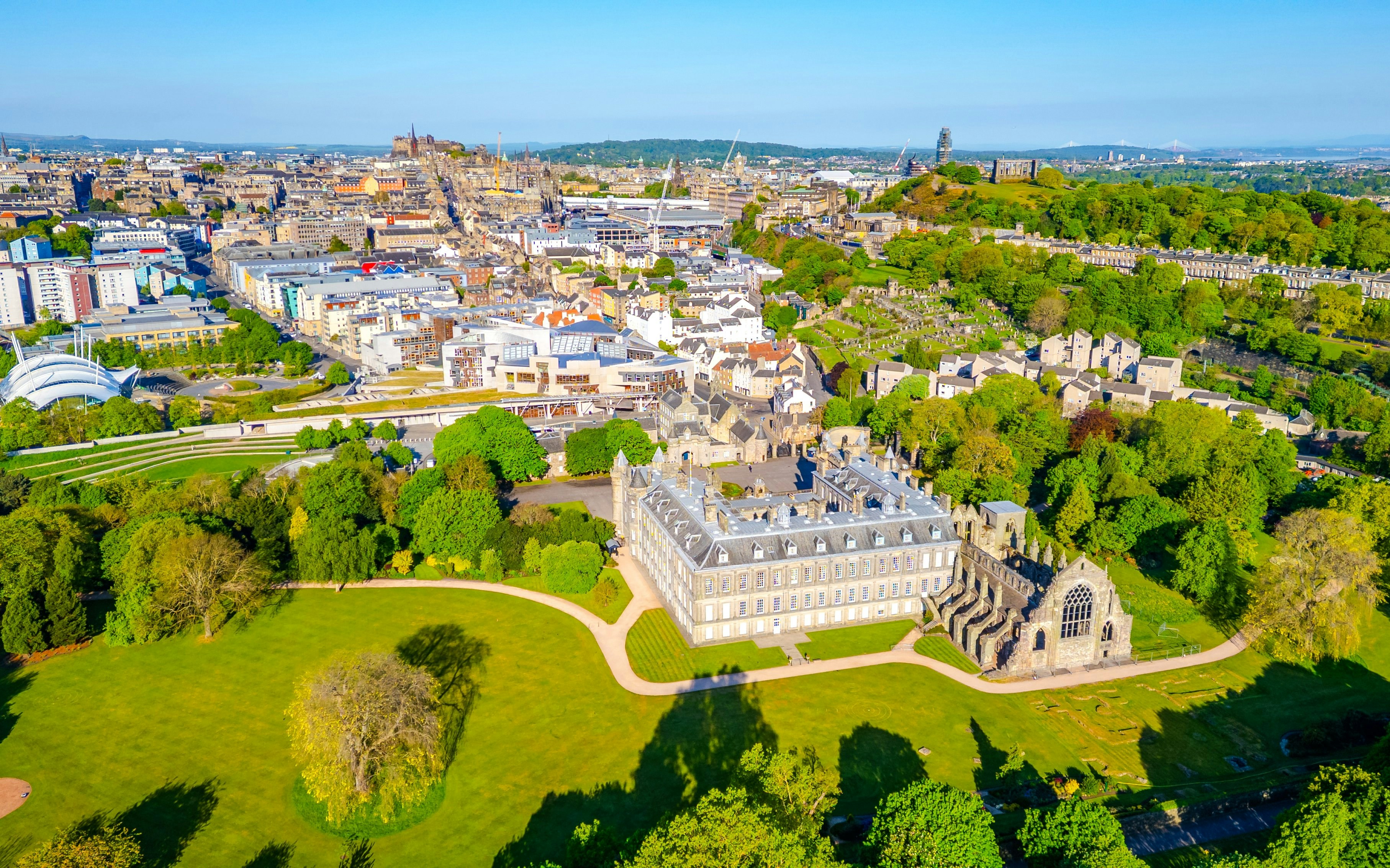 Aerial view of Holyrood Abbey and surrounding gardens in Edinburgh, Scotland.