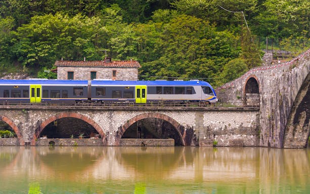 Trenitalia train crossing Devil's Bridge from Pisa to Florence.