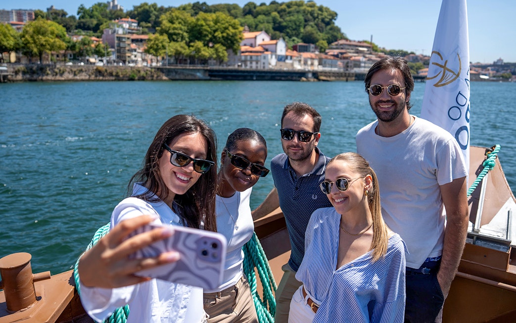Group enjoying Douro River cruise in Porto, Portugal.