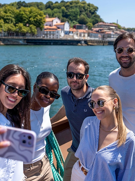 Group enjoying Douro River cruise in Porto, Portugal.