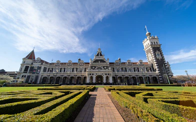 Dunedin Railway Station with gardens, starting point for Taieri Gorge Scenic Rail Journey.