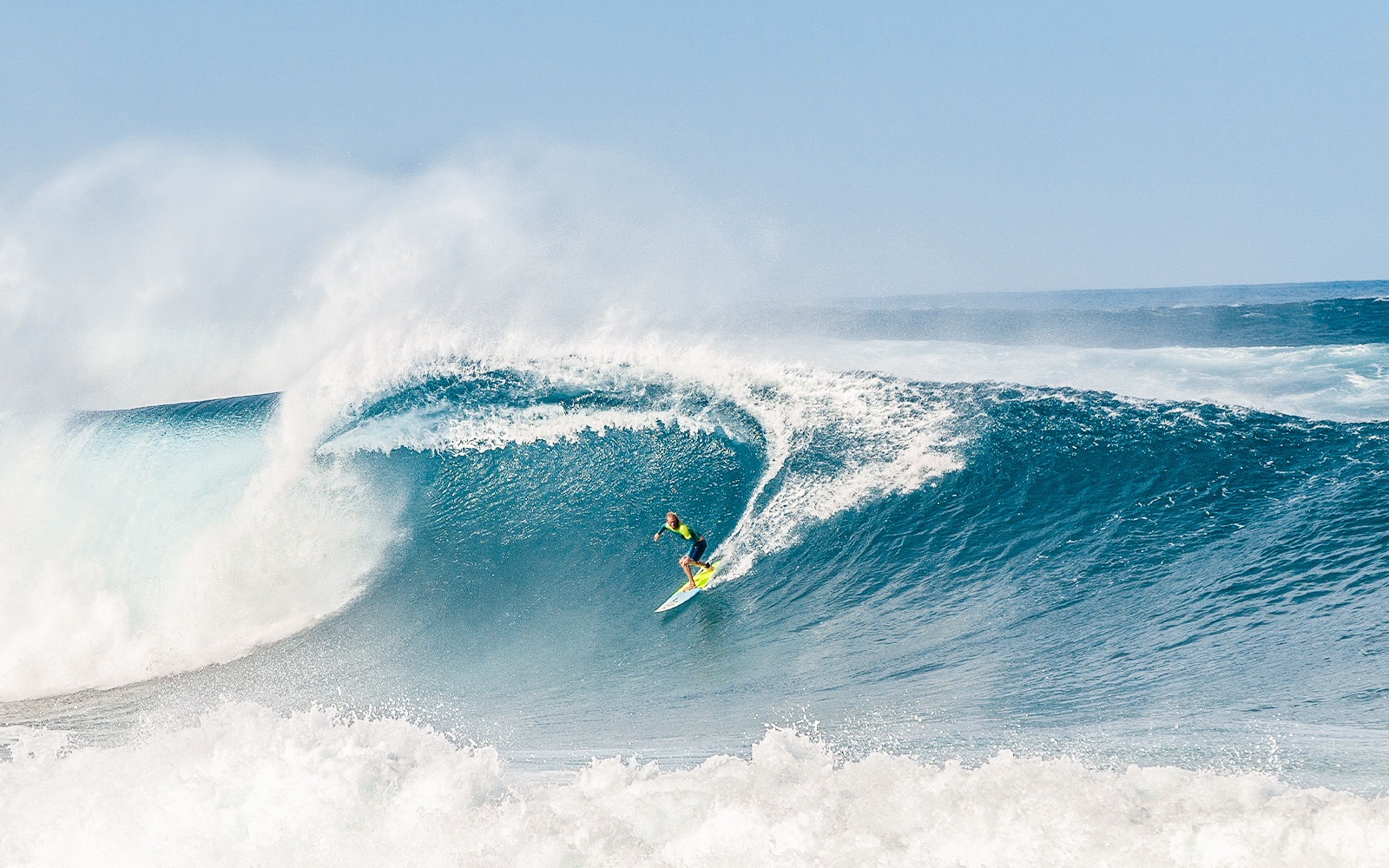 Surfer riding a large wave on North Shore, Hawaii.