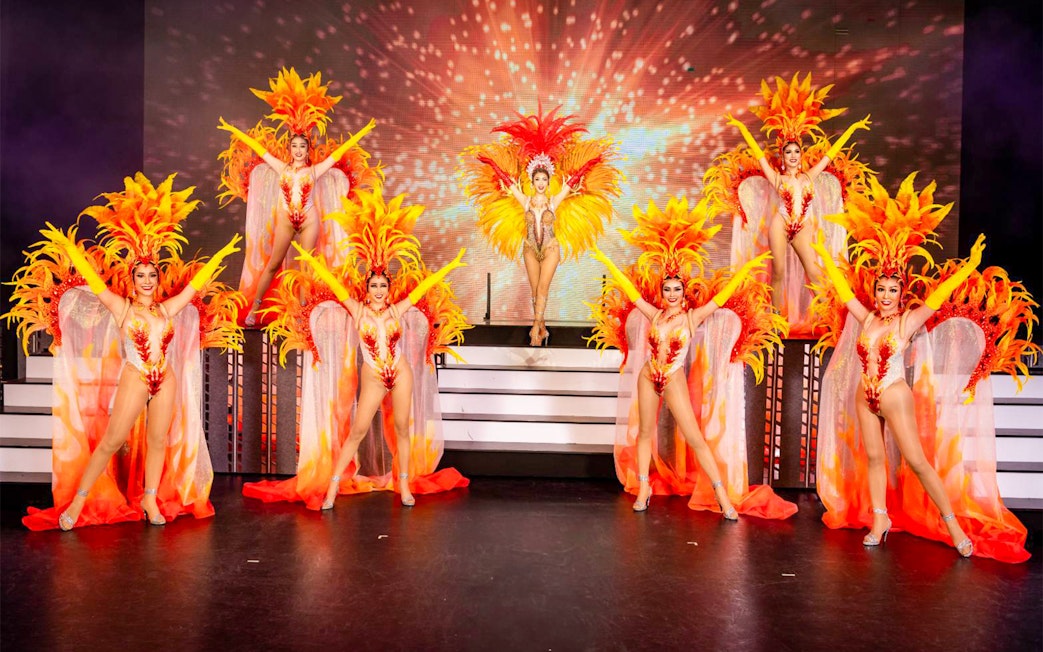 Performers in vibrant costumes at Simon Cabaret Show, Phuket.