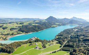 Aerial view of turquoise lake and mountains on Salzburg, Hallstatt day trip from Munich.