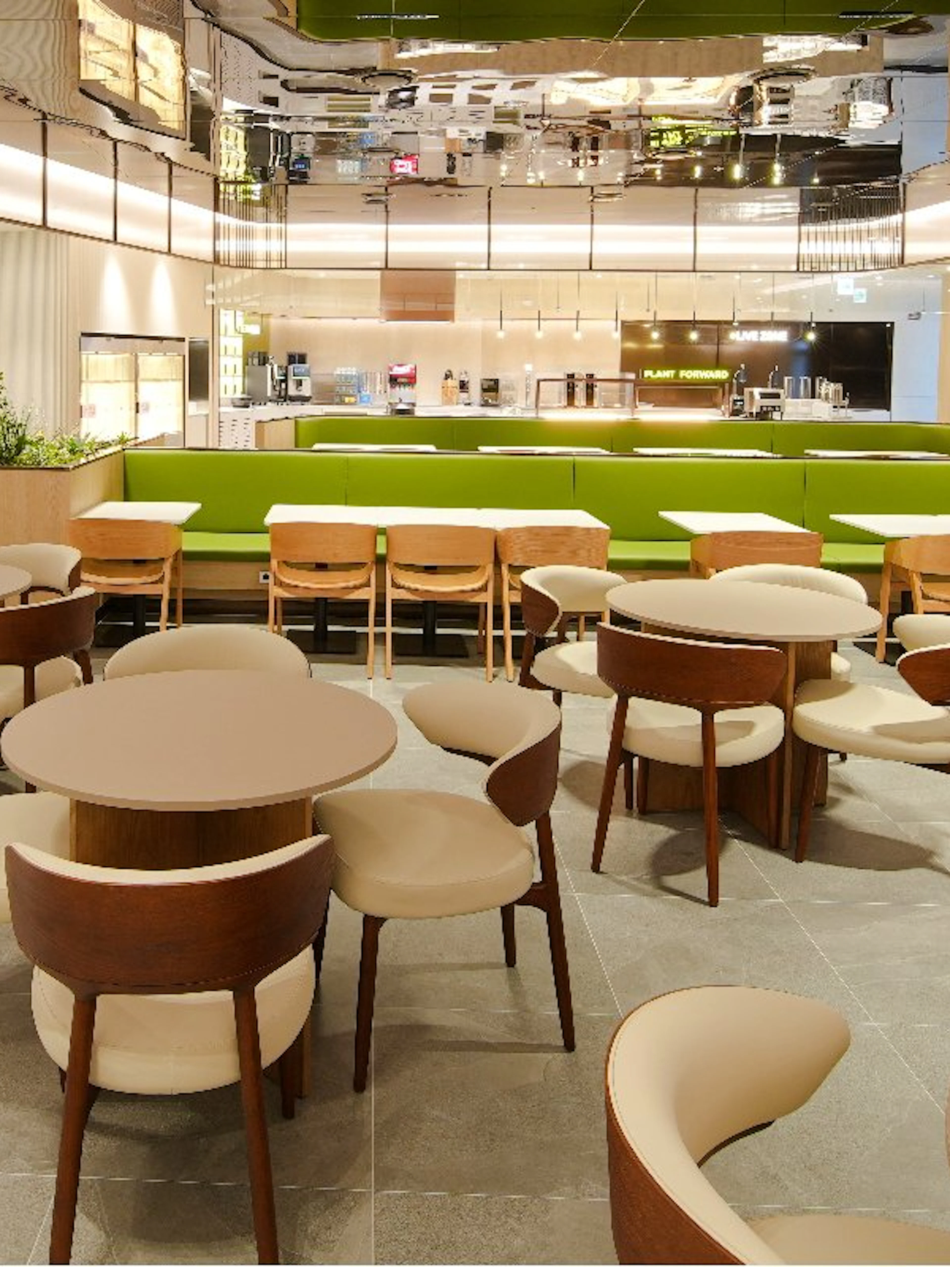 Plaza Premium Lounge interior in South Korea with wooden chairs and modern decor.