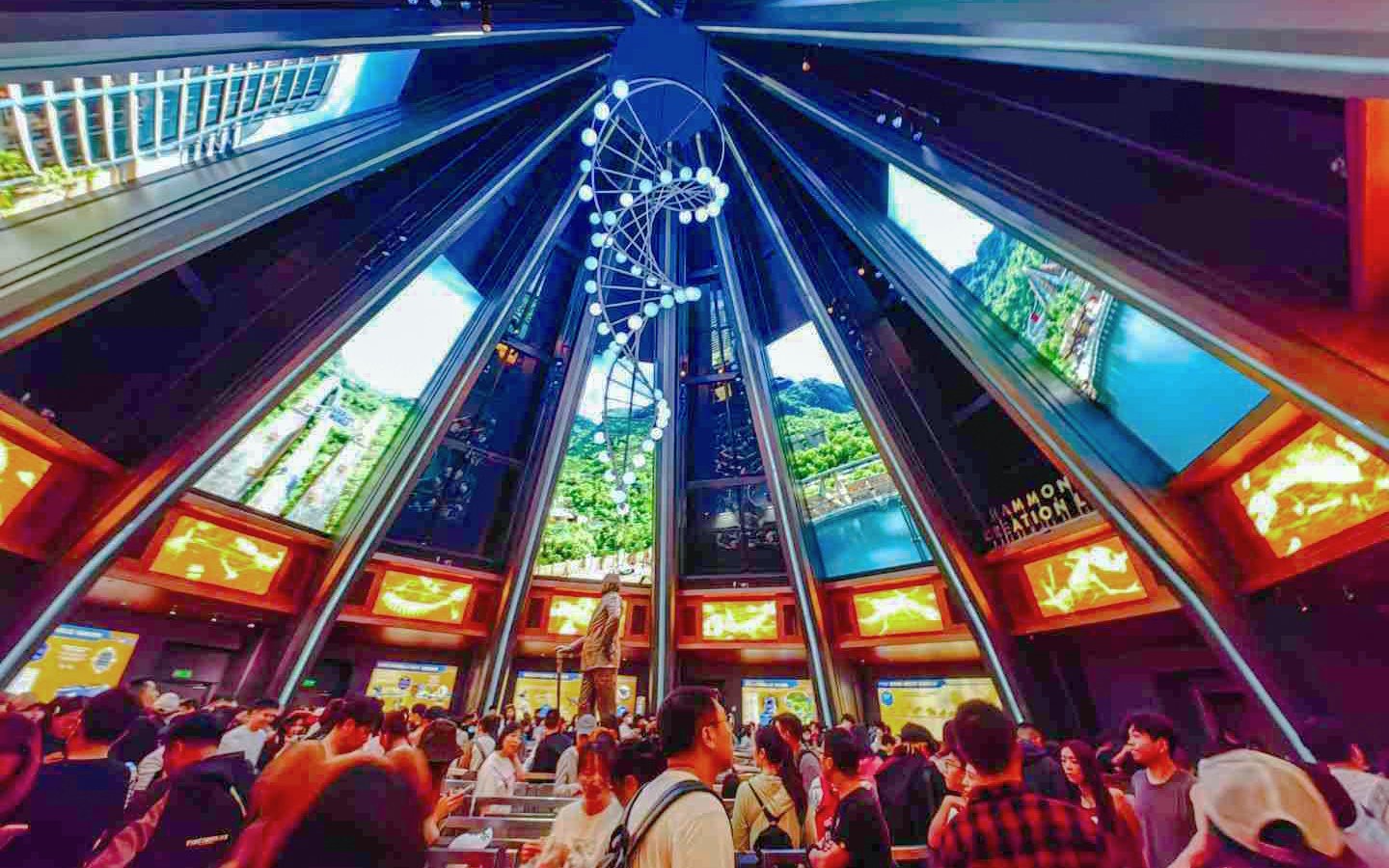 Indoor queue area for Jurassic World Adventure ride at Universal Studios Beijing, featuring a DNA helix sculpture.