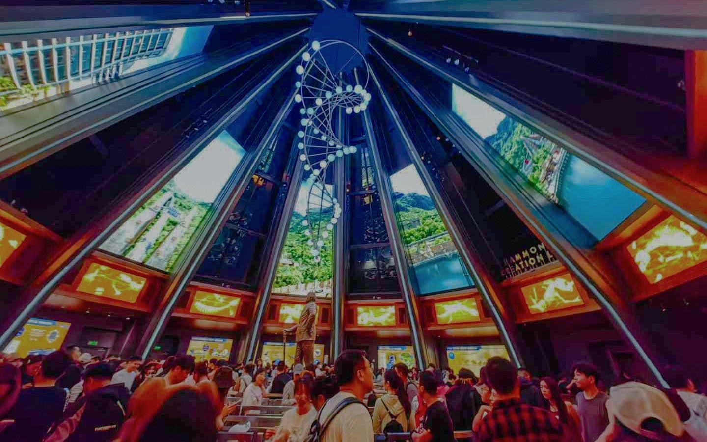 Indoor queue area for Jurassic World Adventure ride at Universal Studios Beijing, featuring a DNA helix sculpture.