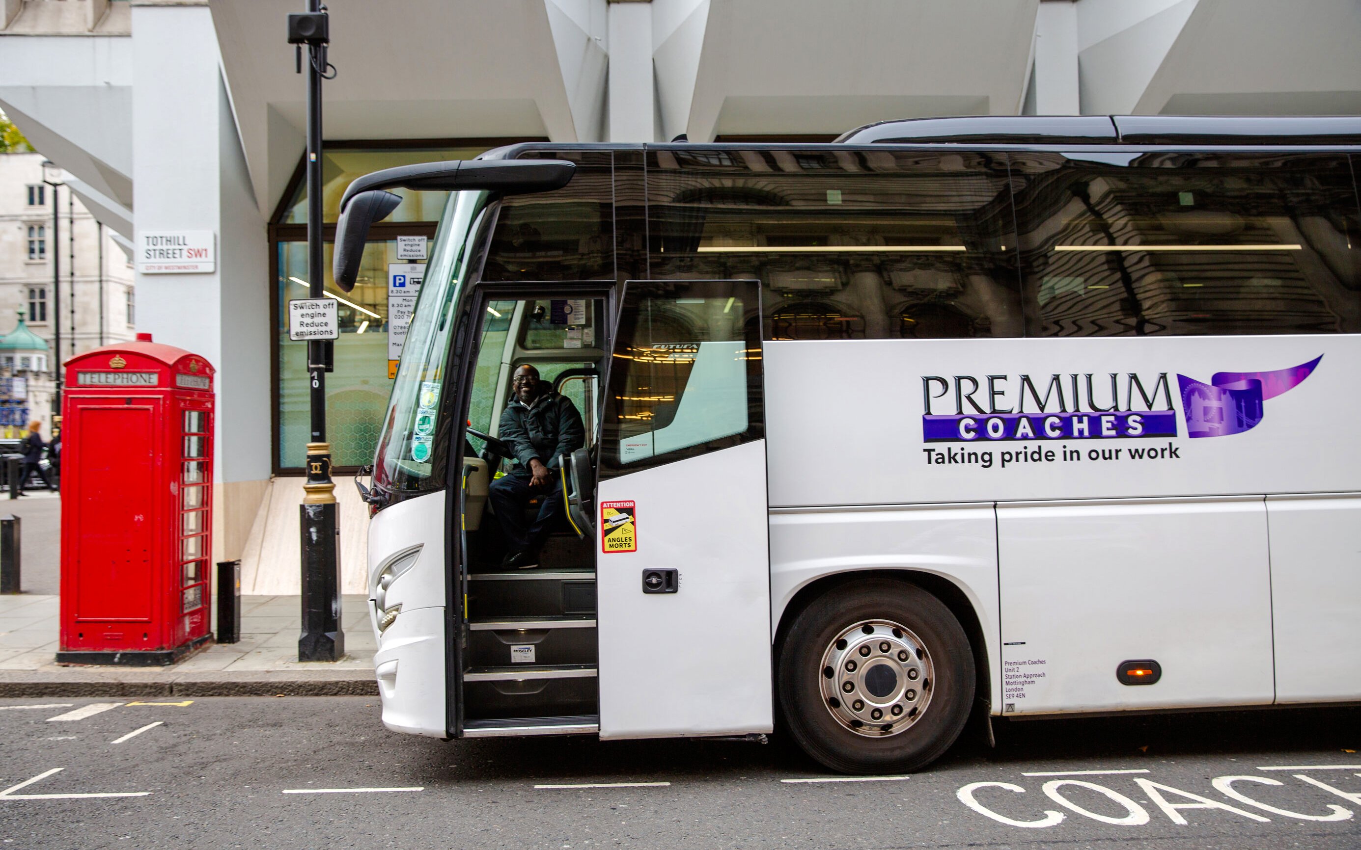 Coach parked on Tothill Street, London, for Stonehenge Day Trip.
