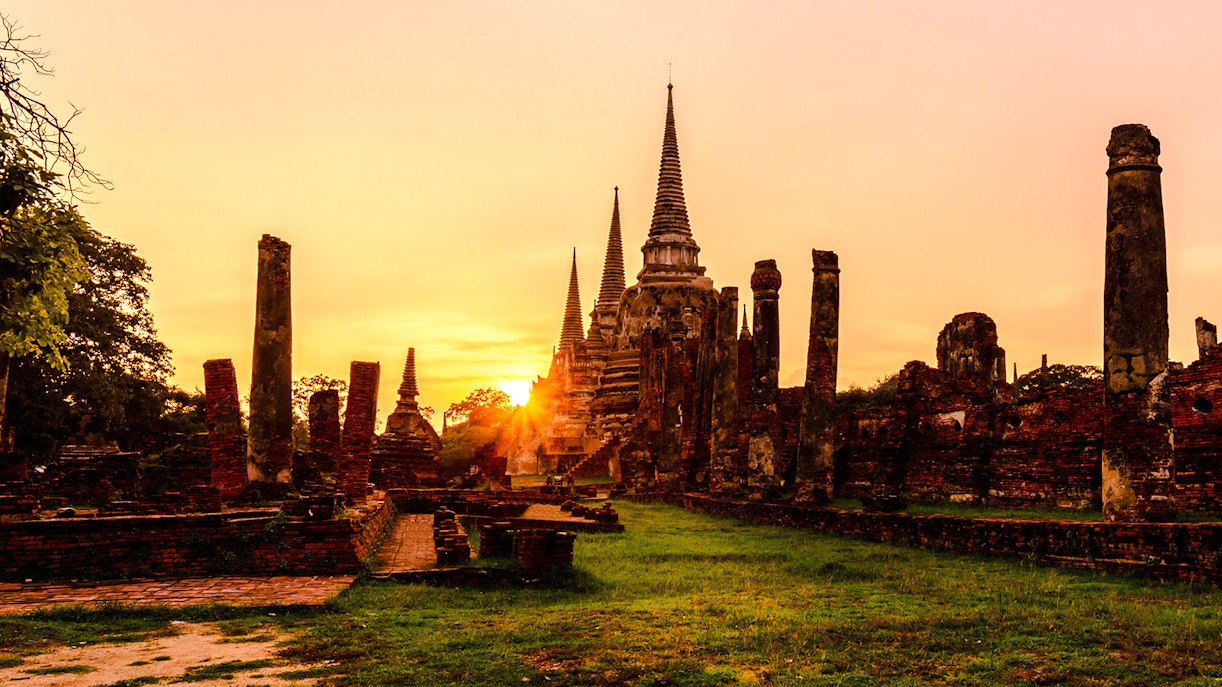 Wat Phra Sri Sanphet ruins at sunset in Ayutthaya Historic Park, Thailand.