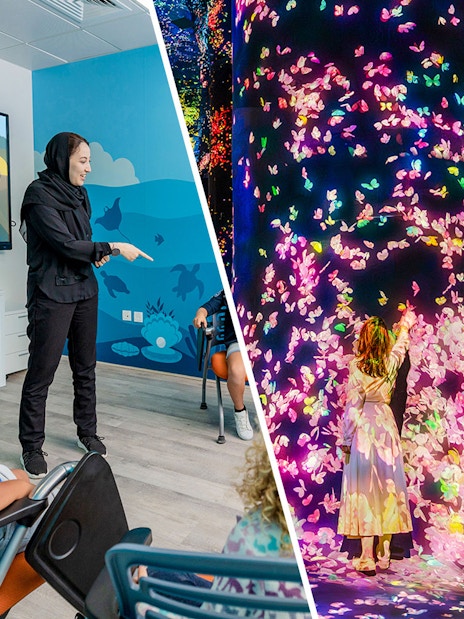 Interactive art installation at Team Lab Abu Dhabi with children engaging in digital displays.