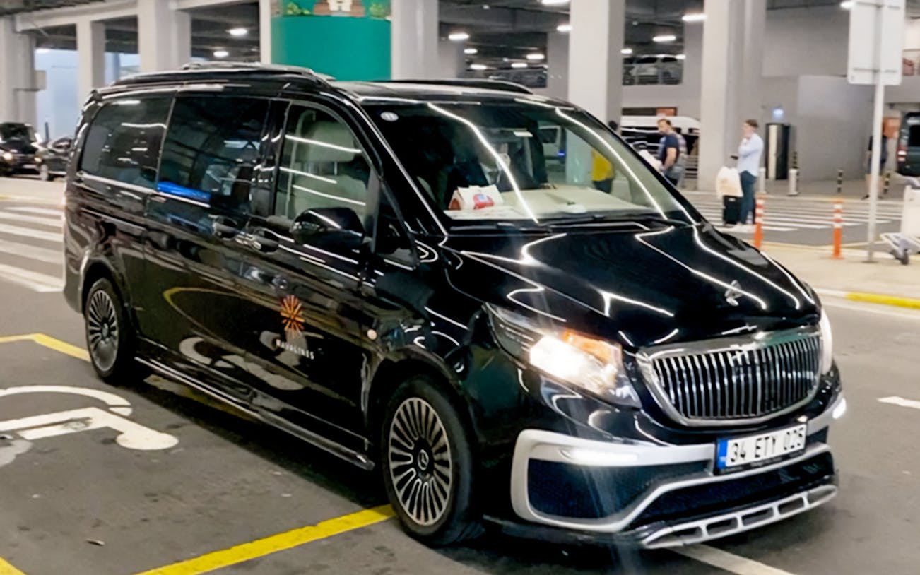 Black van for private transfer at Sabiha Gokcen Airport, Istanbul.