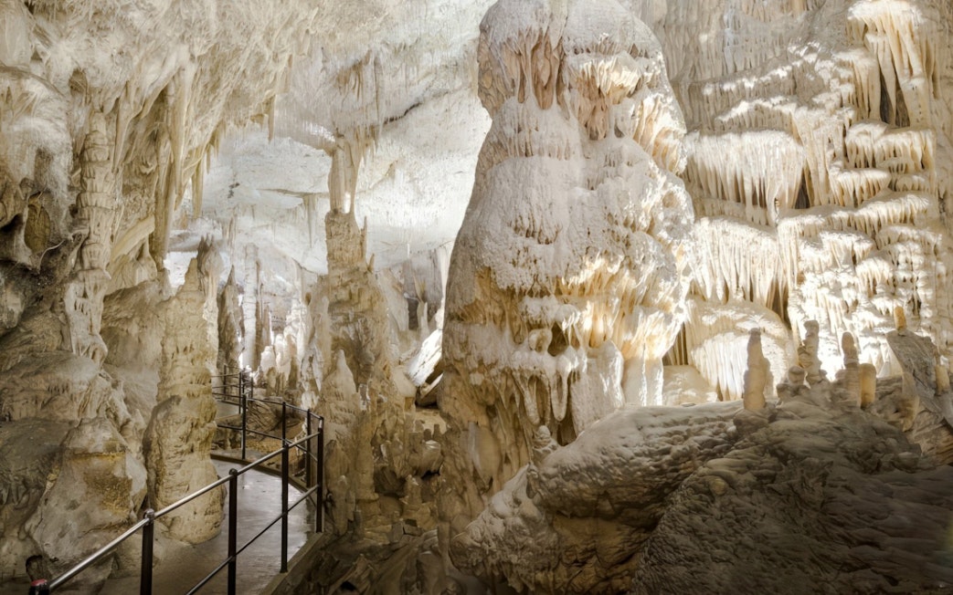 Exploring stalactites and stalagmites in Postojna Cave, Slovenia.