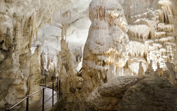 Exploring stalactites and stalagmites in Postojna Cave, Slovenia.