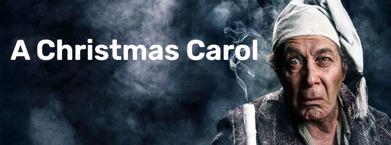 Man in nightcap holding candle, representing Scrooge from A Christmas Carol.