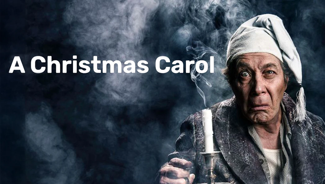 Man in nightcap holding candle, representing Scrooge from A Christmas Carol.