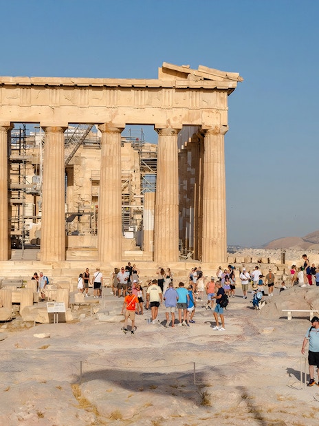 Tourists exploring the Parthenon at the Acropolis in Athens, Greece.