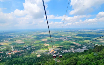 Cable car view over lush landscape near Black Virgin Mountain, Ho Chi Minh City.
