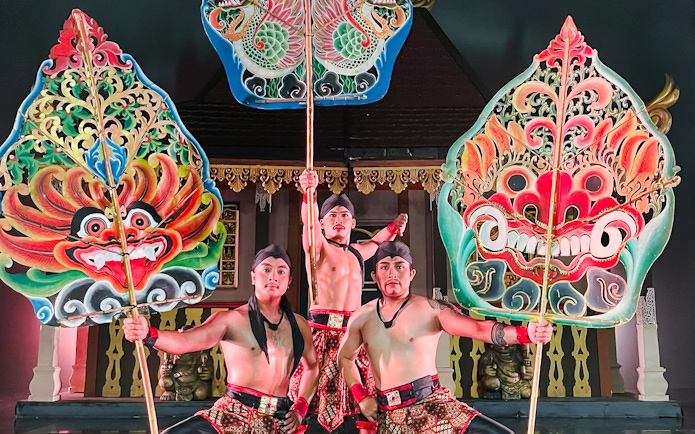 Performers at Devdan Show Bali in traditional Indonesian dance costumes.