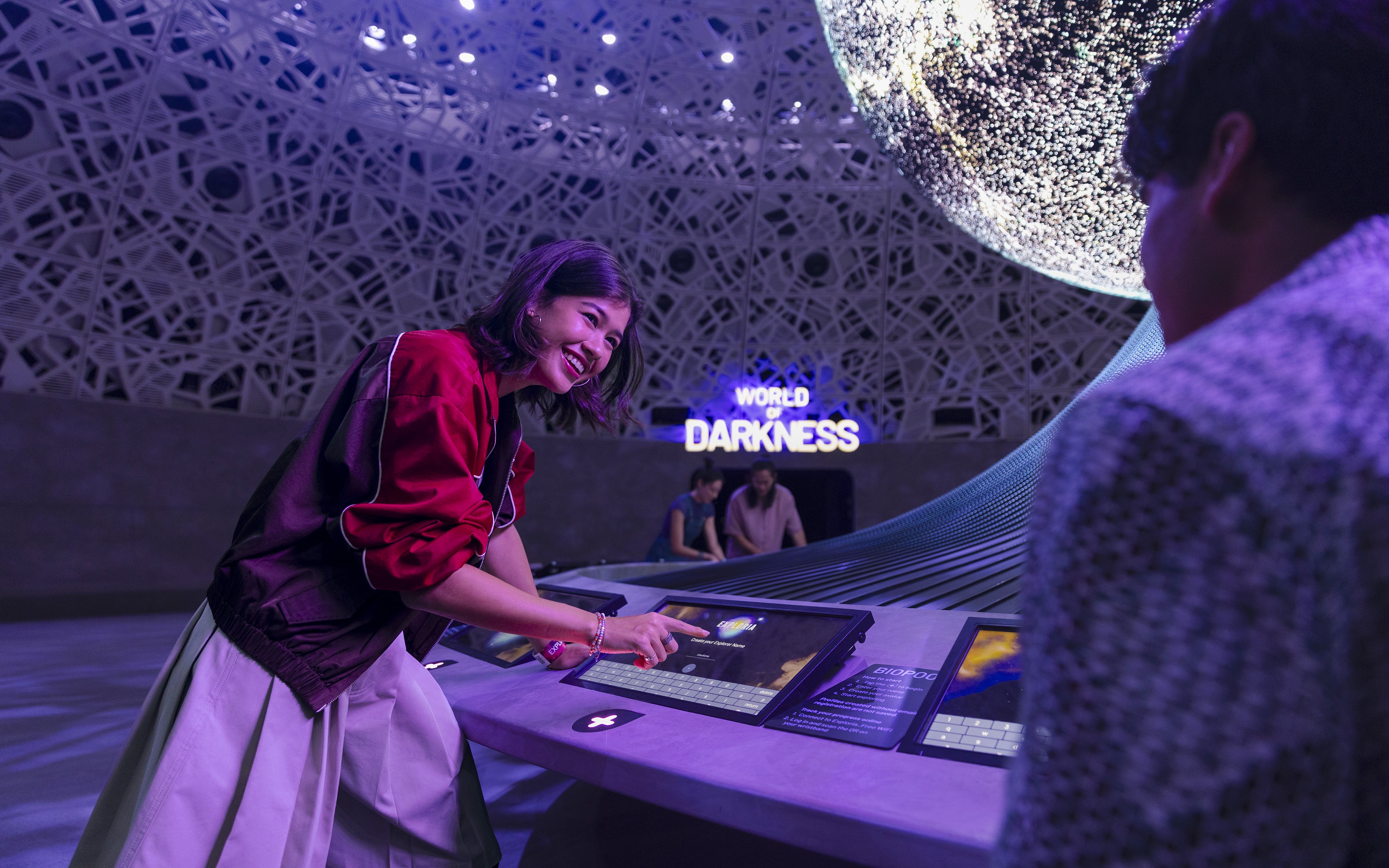 Interactive display at Biopool in Exploria, Mandai Wildlife, with visitors engaging in activities.