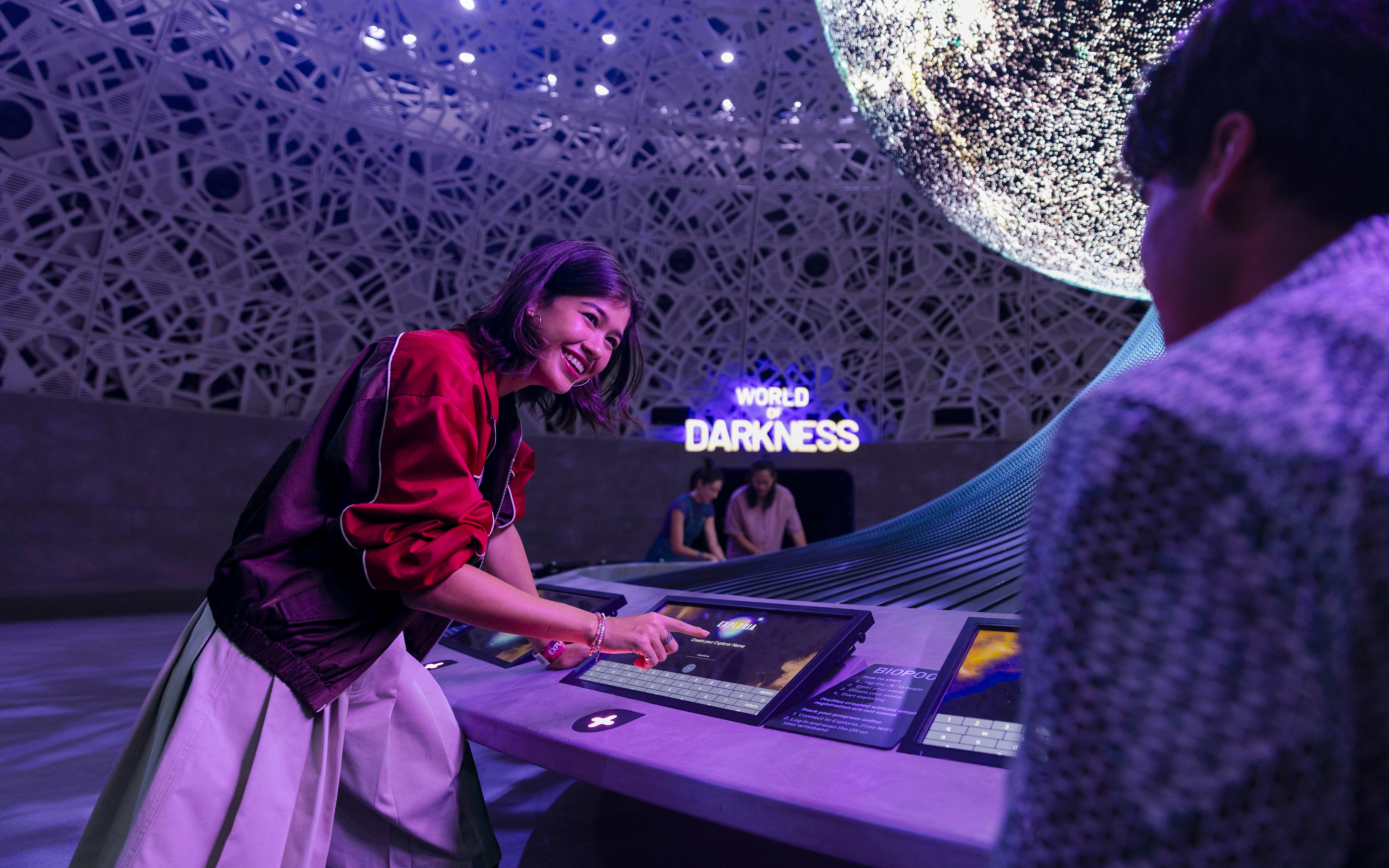 Interactive display at Biopool in Exploria, Mandai Wildlife, with visitors engaging in activities.