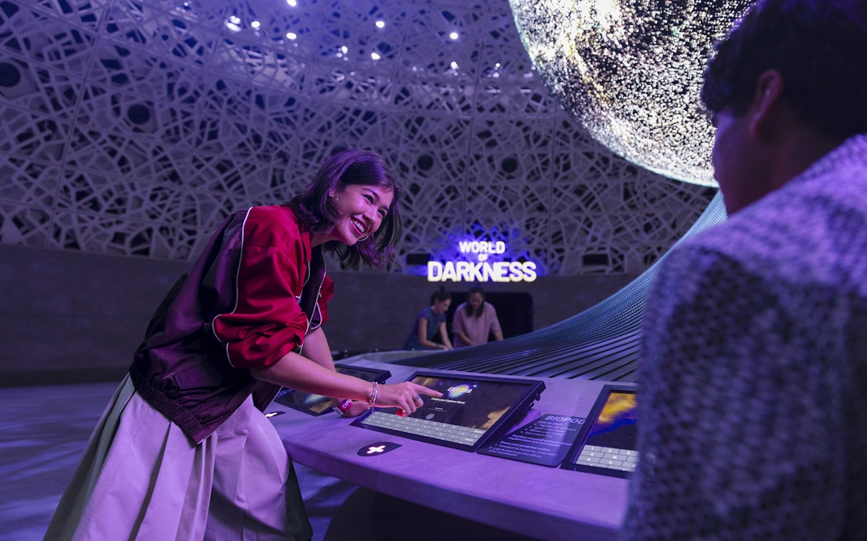 Interactive display at Biopool in Exploria, Mandai Wildlife, with visitors engaging in activities.