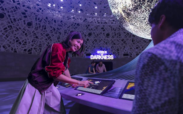 Interactive display at Biopool in Exploria, Mandai Wildlife, with visitors engaging in activities.