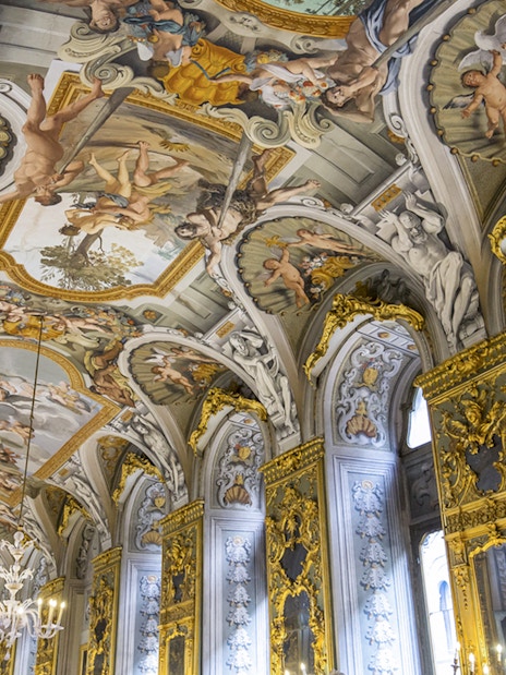 Doria Pamphilj Gallery ceiling frescoes with intricate gold detailing and classical figures.