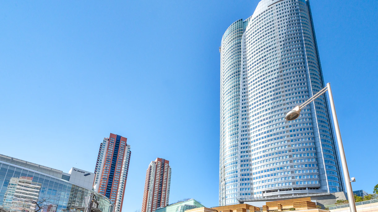 TV Asahi headquarters in Roppongi Hills, Tokyo, with modern skyscrapers.