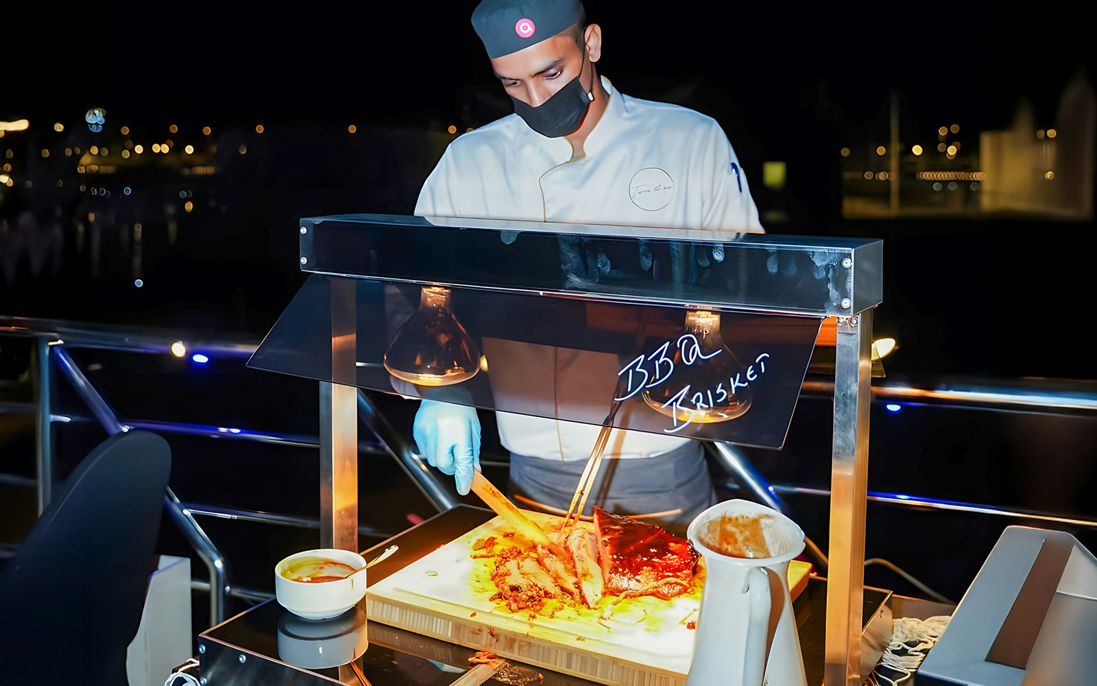 Luxury dhow cruise with barbecue station on Dubai Marina.