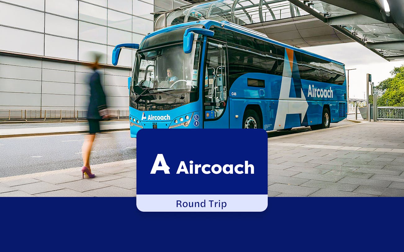 Aircoach bus at Dublin Airport terminal for city center round-trip service.