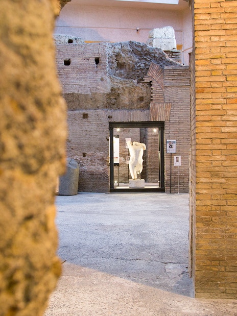 Ancient brick walls and statue at Domitian Stadium, Rome.