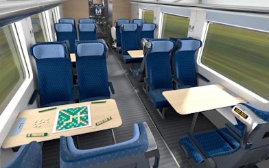 Interrail train seats with tables and a board game setup.