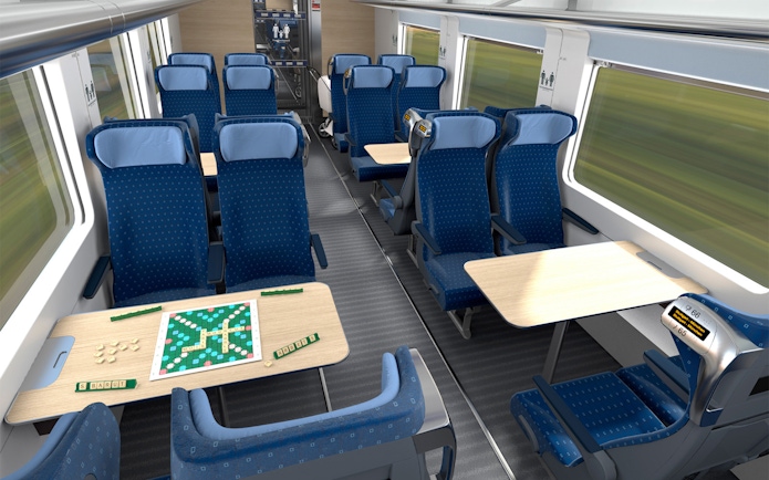 Interrail train seats with tables and a board game setup.