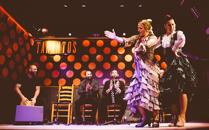 Flamenco dancers performing at Los Tarantos Flamenco Show in Barcelona.