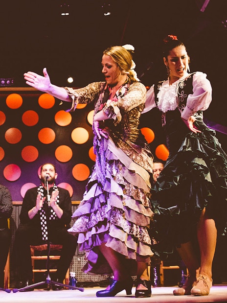 Flamenco dancers performing at Los Tarantos Flamenco Show in Barcelona.