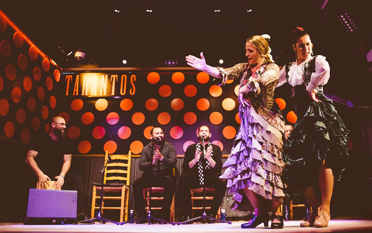 Flamenco dancers performing at Los Tarantos Flamenco Show in Barcelona.