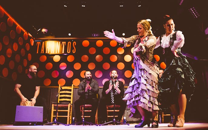 Flamenco dancers performing at Los Tarantos Flamenco Show in Barcelona.