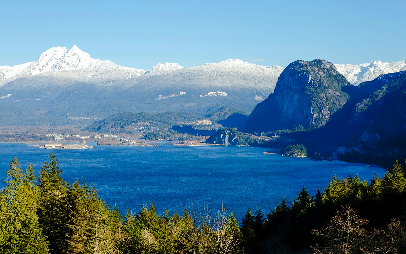 Howe Sound in Canada with snow-capped mountains and blue waters.