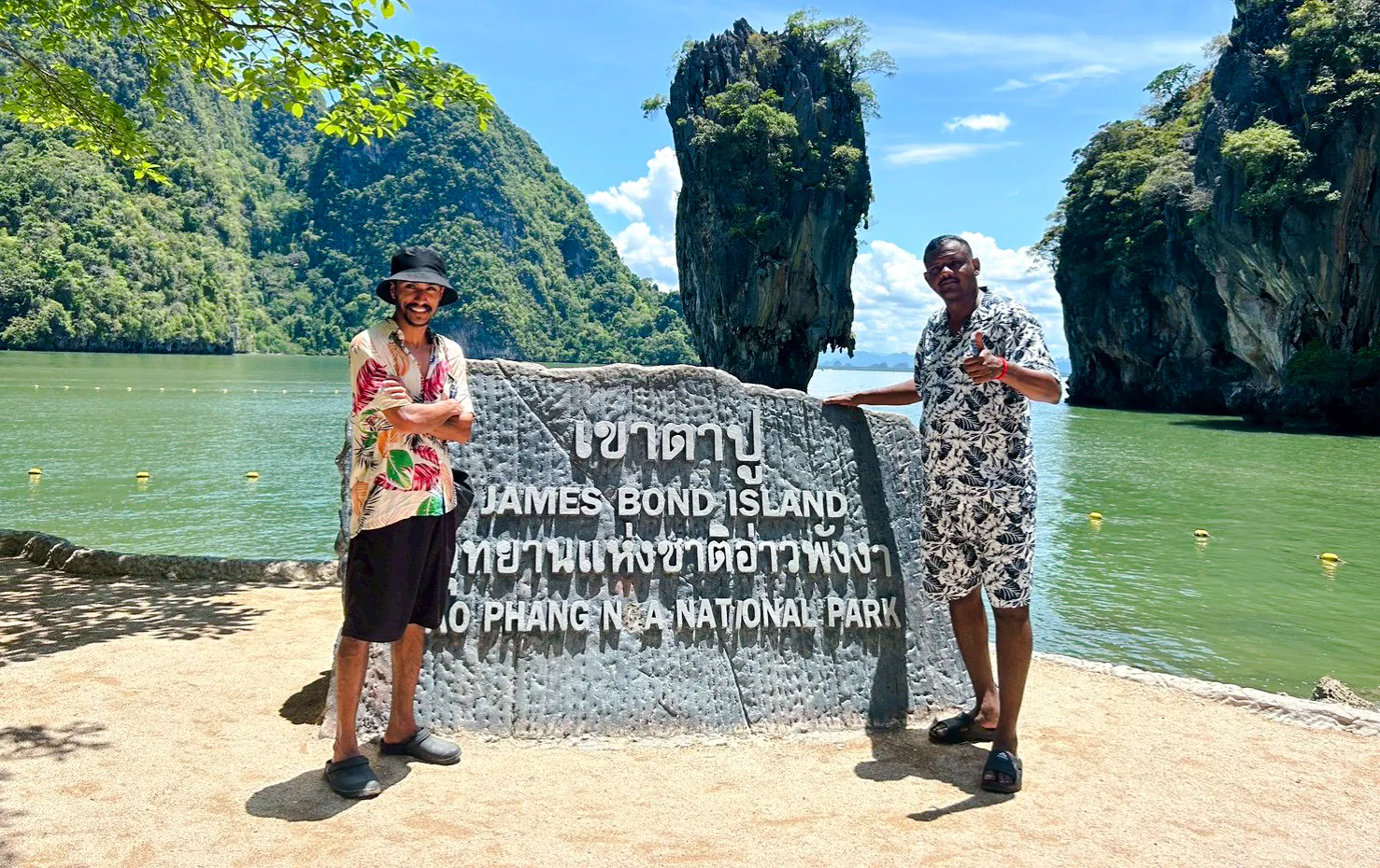 James Bond Island sign with limestone cliffs in Phang Nga Bay, Phuket.